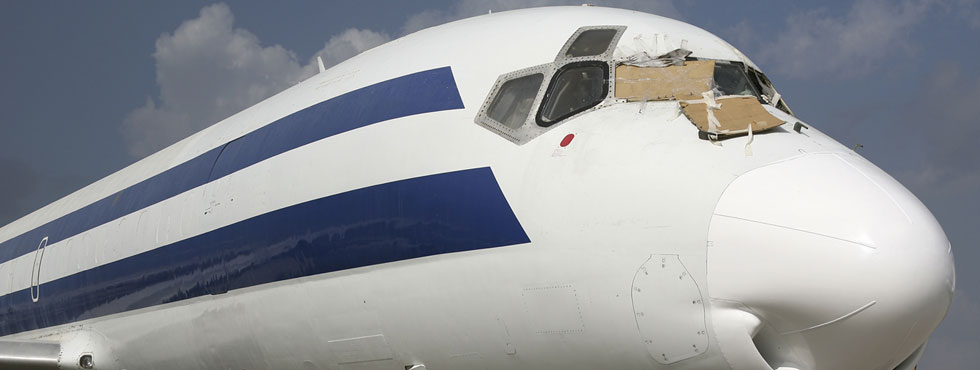 Front view of jet airliner's damaged cockpt windows area