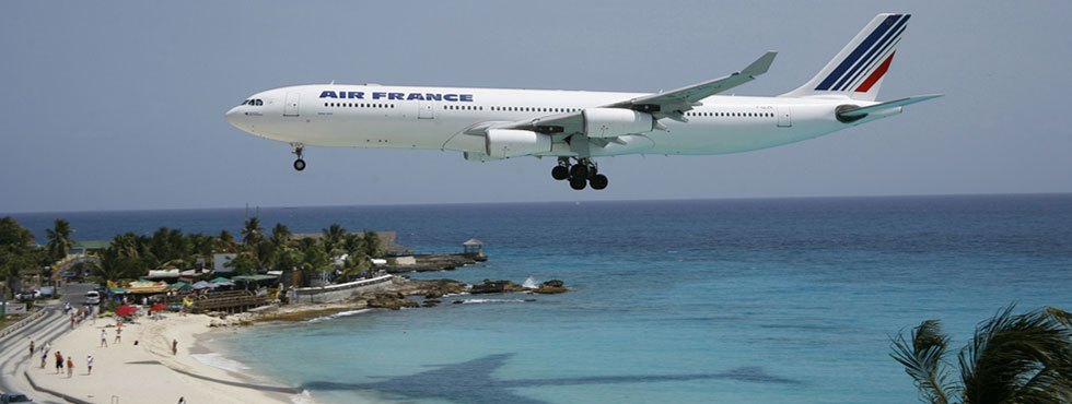 Top-Image-AF Air France Airbus A-340 landing on Caribbean island (very low over beach - just short of runway)