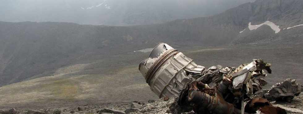 aaa Crashed airliner's jet engine (part of wreckage) standing alone on top of mountain