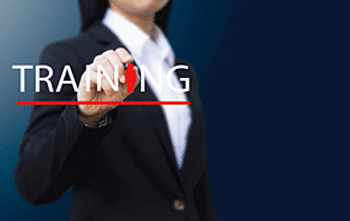 side16 Stylised image of a teacher / trainer writing the word 'TRAINING' on a transparent plastic board
